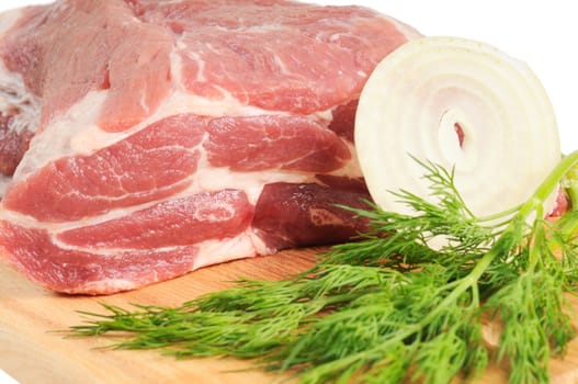 Piece of pork for roasting on a wooden board. Isolated on white.