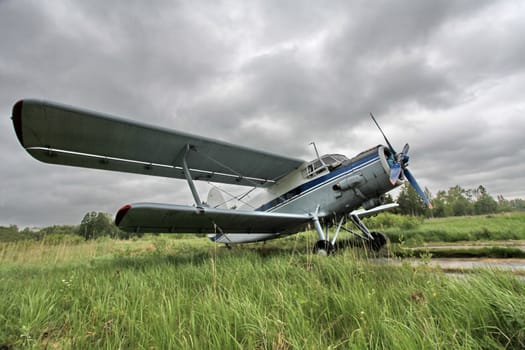 Biplane on the airfield side view