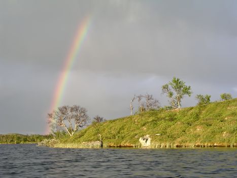 Beautiful landscape of rainbow and lake