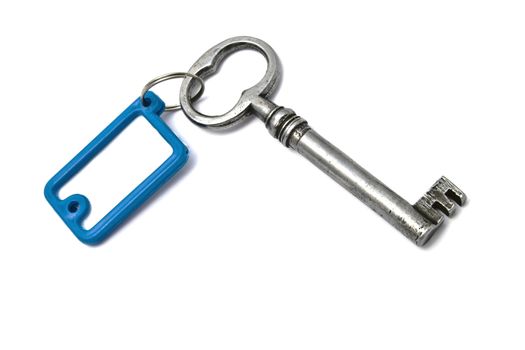 Blank tag and old key isolated on white background 
