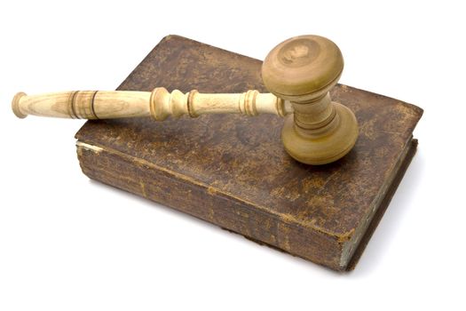 Old book and gavel isolated on white background 
