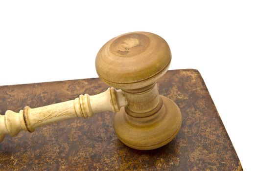 Old book and gavel isolated on white background 
