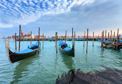  Gondolas. San Giorgio Maggiore. Venice. Venice is a city in northeast Italy which is renowned for the beauty of its setting, its architecture and its artworks. It is the capital of the Veneto region.