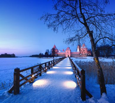Trakai. Trakai is a historic city and lake resort in Lithuania. It lies 28 km west of Vilnius, the capital of Lithuania.   