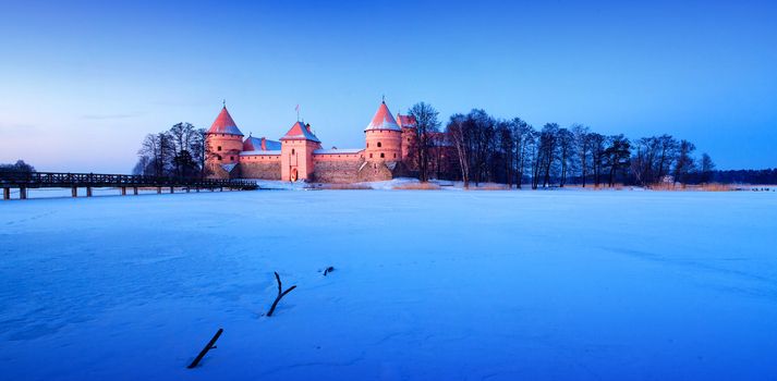 Trakai. Trakai is a historic city and lake resort in Lithuania. It lies 28 km west of Vilnius, the capital of Lithuania.   