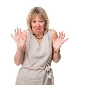 Attractive Mature Woman with Shocked Horrified Expression Holding up Hands Isolated