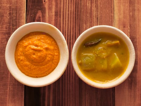 close up of bowls of traditional indian sauces