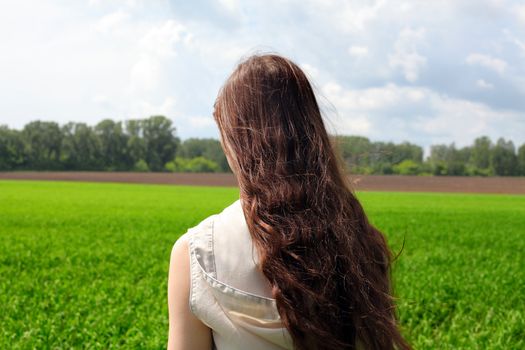 teenage girl in the summer field