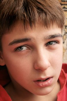 sad and confused teenager portrait close up