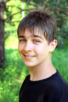 portrait of the smiling teenager outdoor