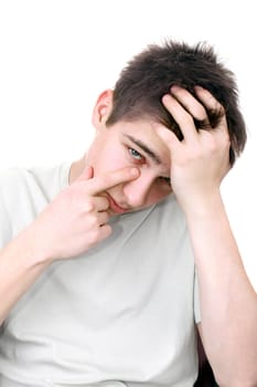 sad young man wipe tears isolated on the white background