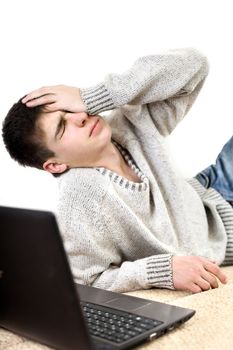 sad and troubled teenager with notebook on the sofa