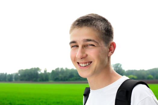 happy teenager portrait in the summer field