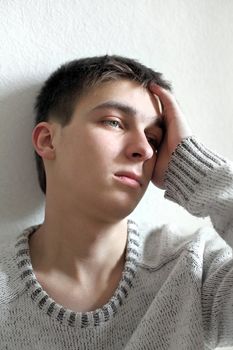sad young man portrait in home