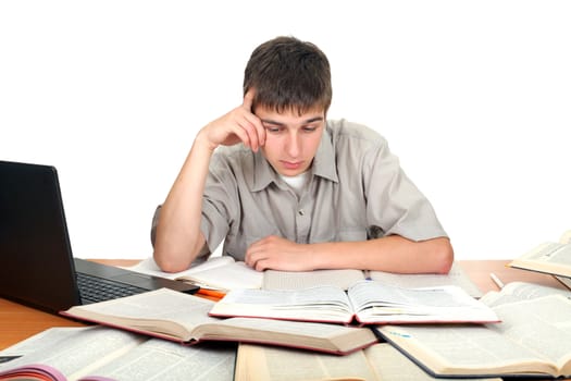 young male student working with many books on the table