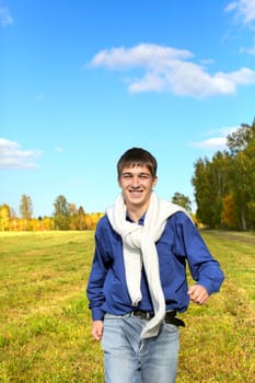 happy teenager running on the autumn field