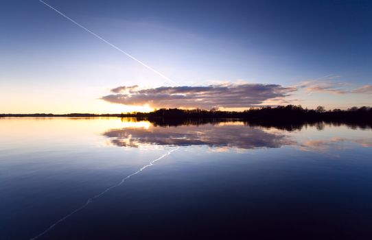 symmetry of reflection of the sky during the sunset in lake