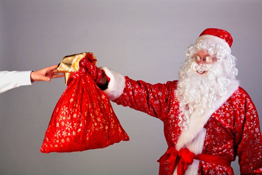 santa claus gives a christmas gifts