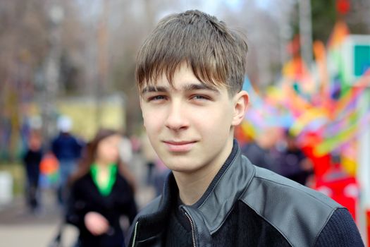 teenager portrait on the city street with the people on the blurred background