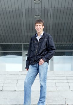 portrait of smiling teenager on the stairs