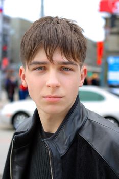 sad teenager portrait on the city street