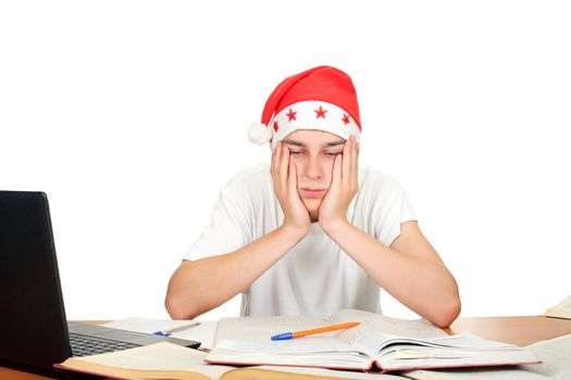 bored and tired student in santa's hat. isolated on the white background