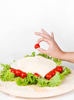italian cheese Provolone with tomatoes and salad. hand say ok quality