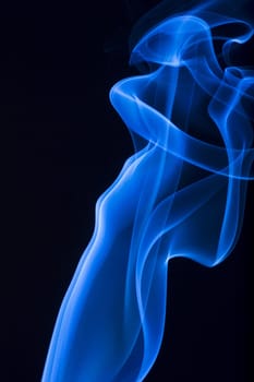 blue smoke over black background