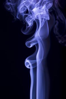 blue smoke over black background