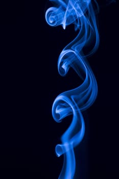 blue smoke over black background