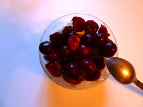 fresh cherries as desert on white background