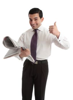 A businessman, investor or stockbroker with the financial newspaper and showing a thumbs up hand sign