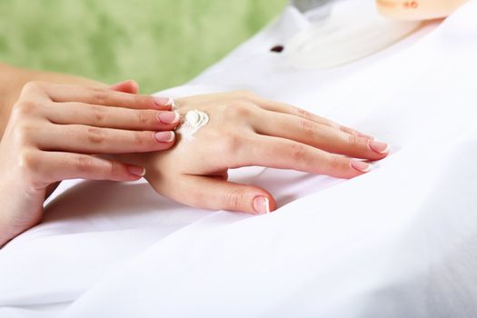 Female hands and manicure related objects in spa salon