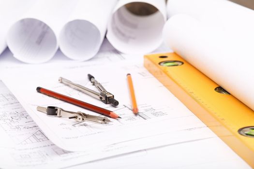 Tools and papers with sketches on the table