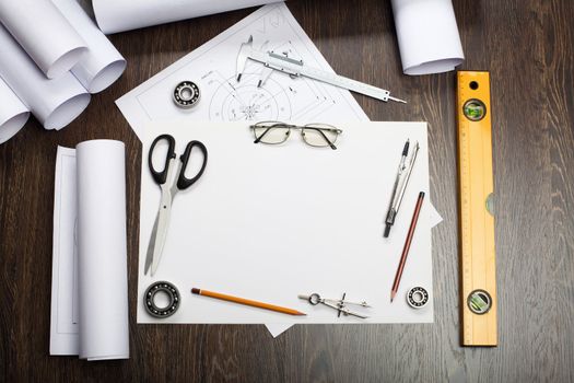 Tools and papers with sketches on the table