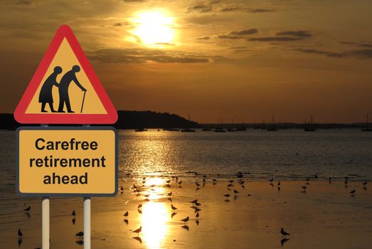 Carefree retirement ahead roadsign with a sunset background