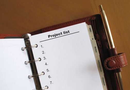 Project list in a personal organizer with blank space for copy