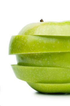 Sections of fresh ripe green apple isolated over white background. Diet concept