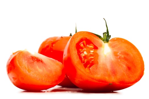 Sections of tomatoes isolated on the white