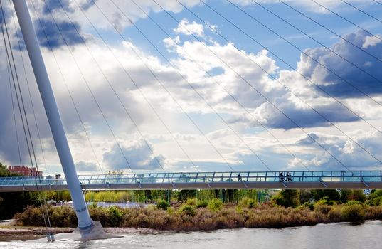 Cityscape with modern bridge and people