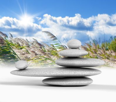 Zen concept with balanced rocks,sky and nature background