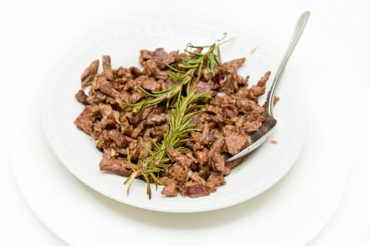 Tibs, Traditioal Ethiopian cusine which is sautéed meat and onions served with rosemerry leaves