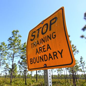 Sign reading Stop Training Area Boundary in central Florida.