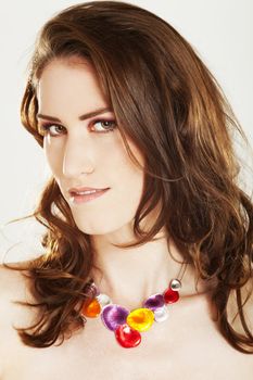 portrait of a young beautiful woman with jewellery isolated