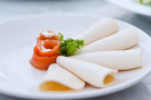 ham  and smoked salmon on white plate