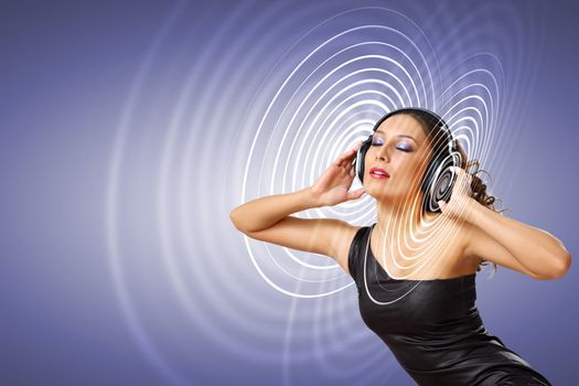 Portrait of young woman with headphones and glittering background