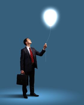 Light bulb and a business person as symbols of creativity in business