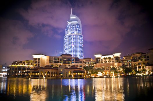 FEB 27- DUBAI, UAE : A nightshot of the Address Hotel and the luxurious buildings of Souk al Bahar with reflection on the water