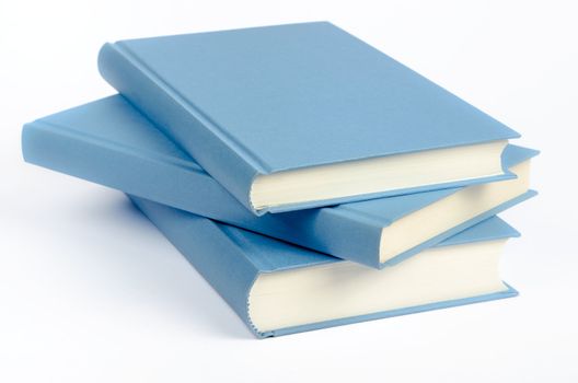 Three blue books on a white background