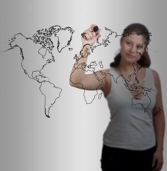 businesswoman drawing the world map in a whiteboard